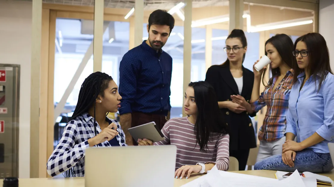 A group of students collaborating in a classroom. 
